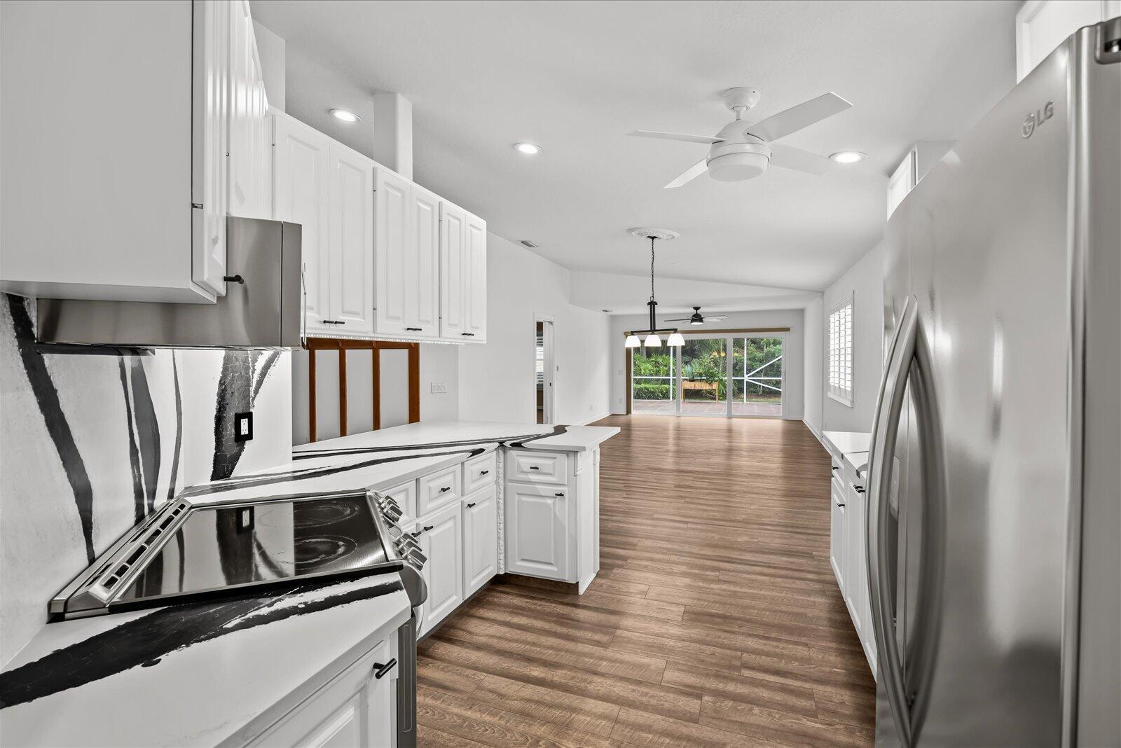 918 Southwest Balmoral Trace Stuart, FL 34997 - Photo 11 of 45 Kitchen through to patio