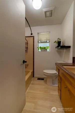 a kitchen with stainless steel appliances granite countertop a sink and stove top oven