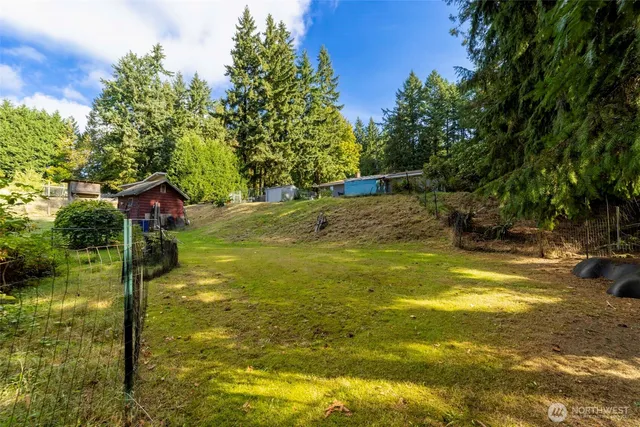 a view of a swimming pool with an outdoor space and seating area