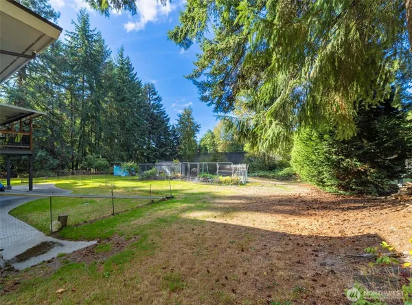 a view of a house with a backyard