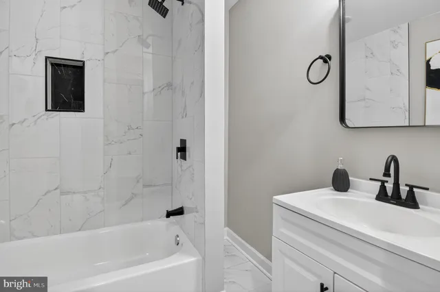 a bathroom with a sink and a bathtub