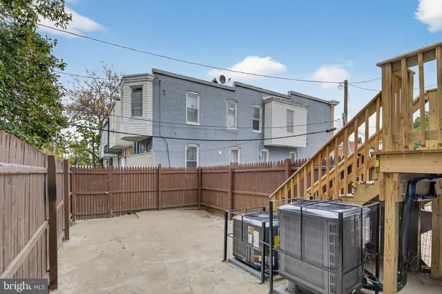 a view of house with wooden stairs and furniture
