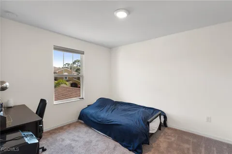 a living room with a couch and a window