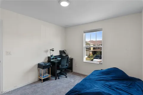 a workspace with furniture and window