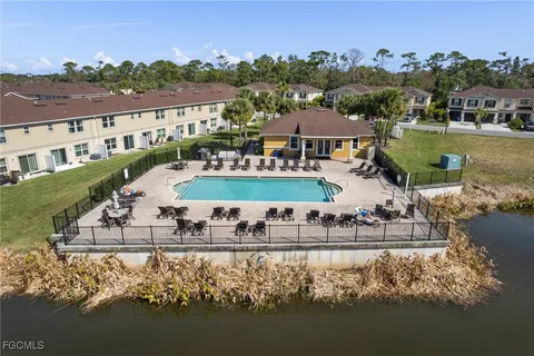 a view of a lake with a house in the background