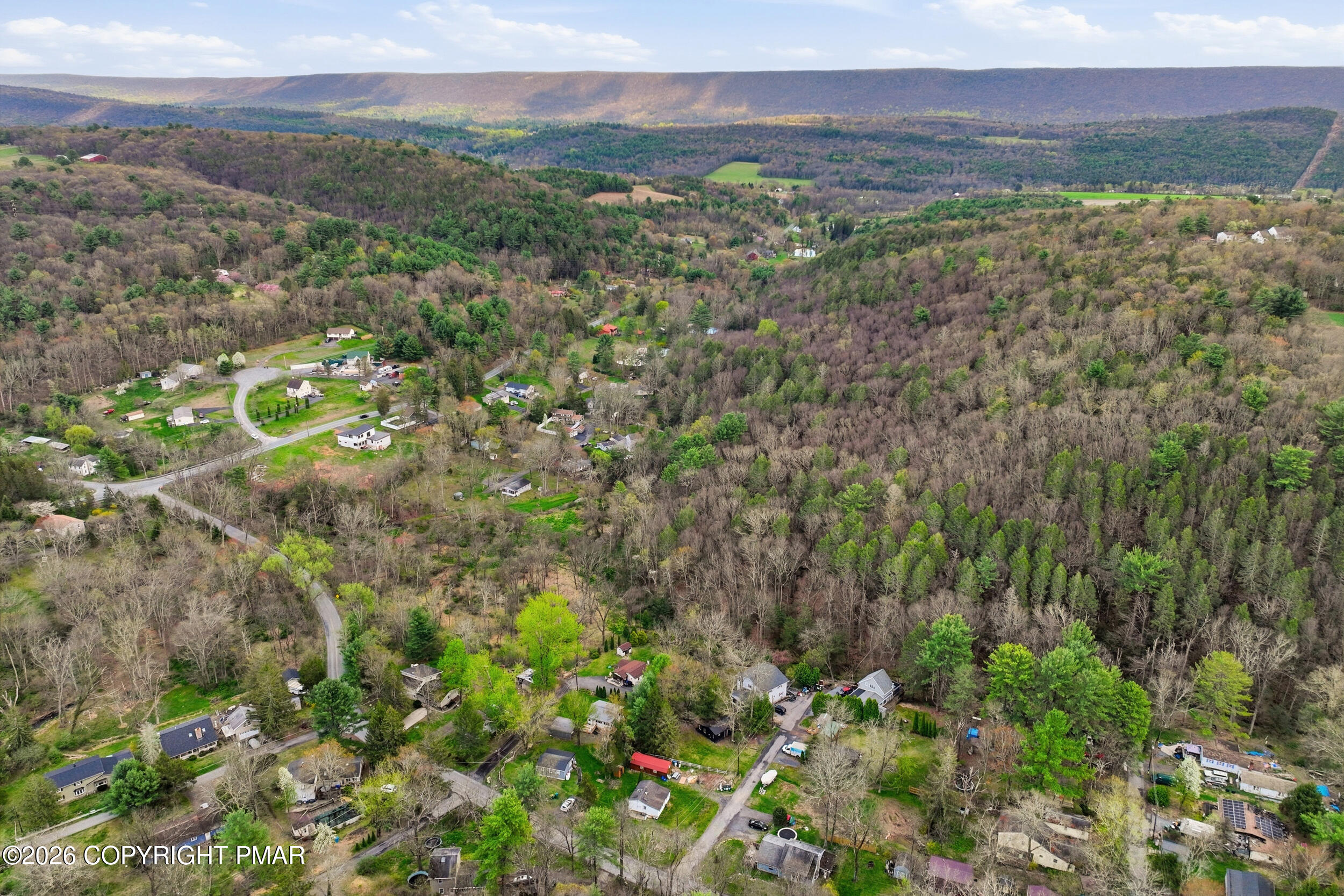 Greenzweig Road Kunkletown, PA 18058 - Photo 16 of 25 a view of a lush green forest with trees and houses