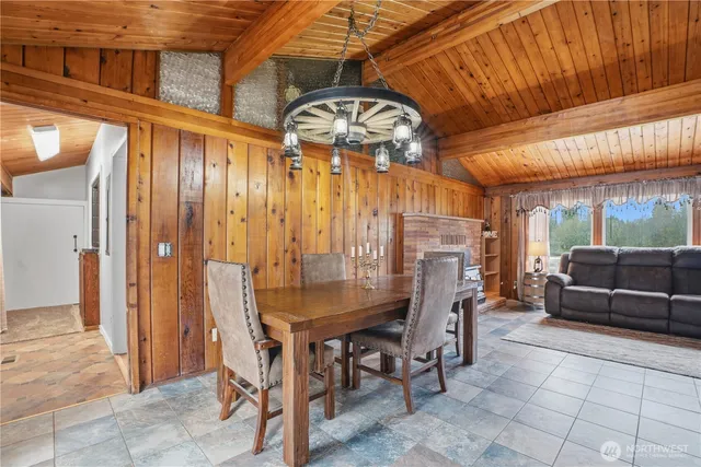 a view of a dining table and chairs in the balcony