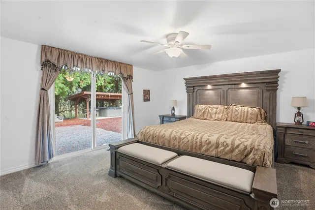 a bedroom with a bed and window