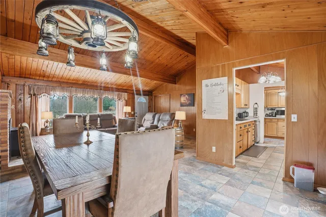 a view of a dining room with furniture window and outside view