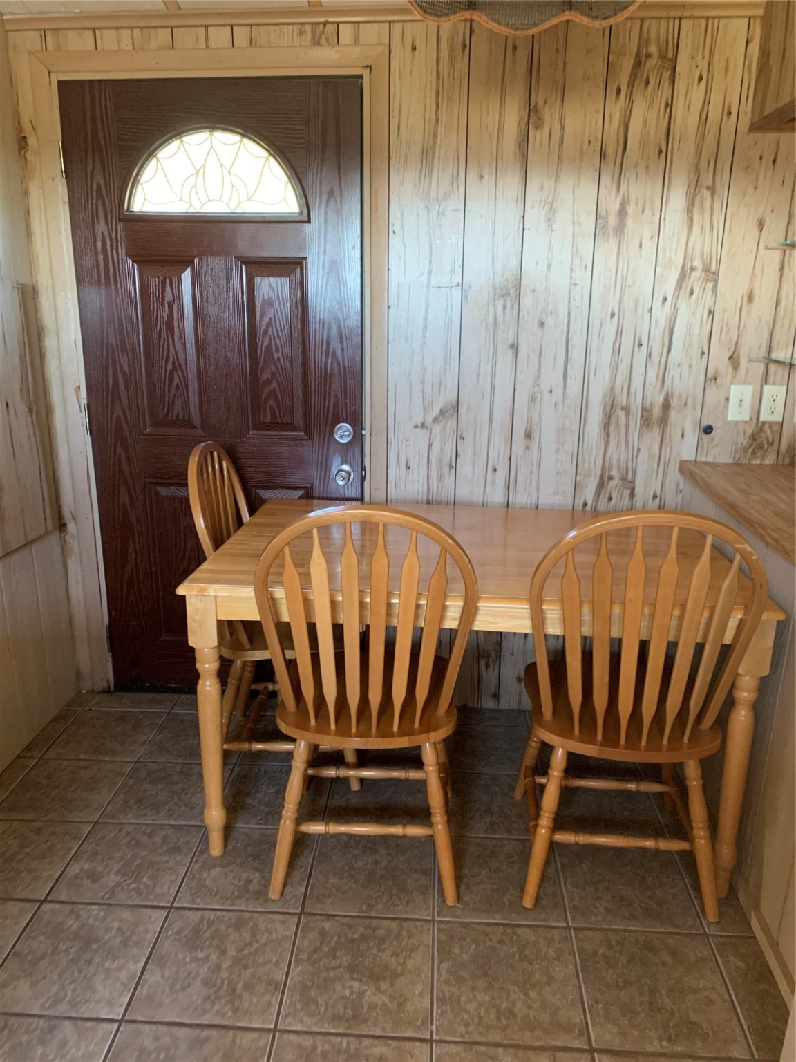 911 15th Street Port O'Connor, TX 77982 - Photo 13 of 22 a view of a dining room with furniture and a chandelier