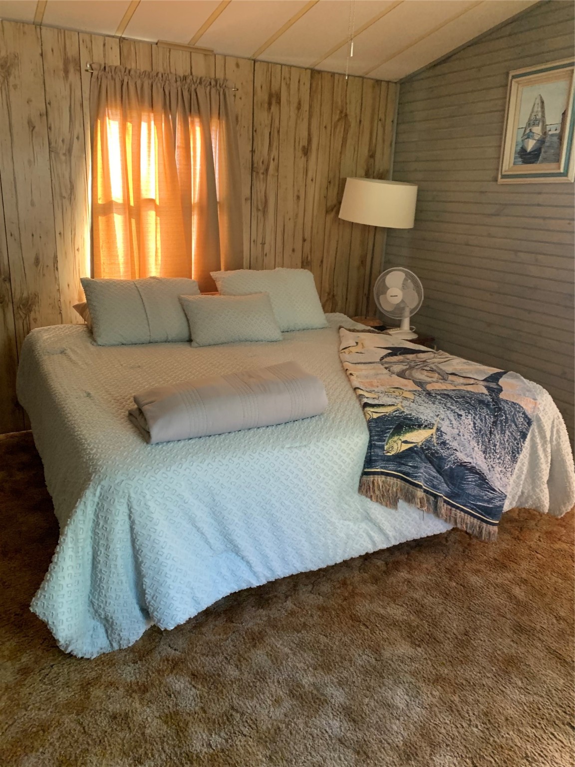 911 15th Street Port O'Connor, TX 77982 - Photo 14 of 22 a bedroom with a bed and a couch