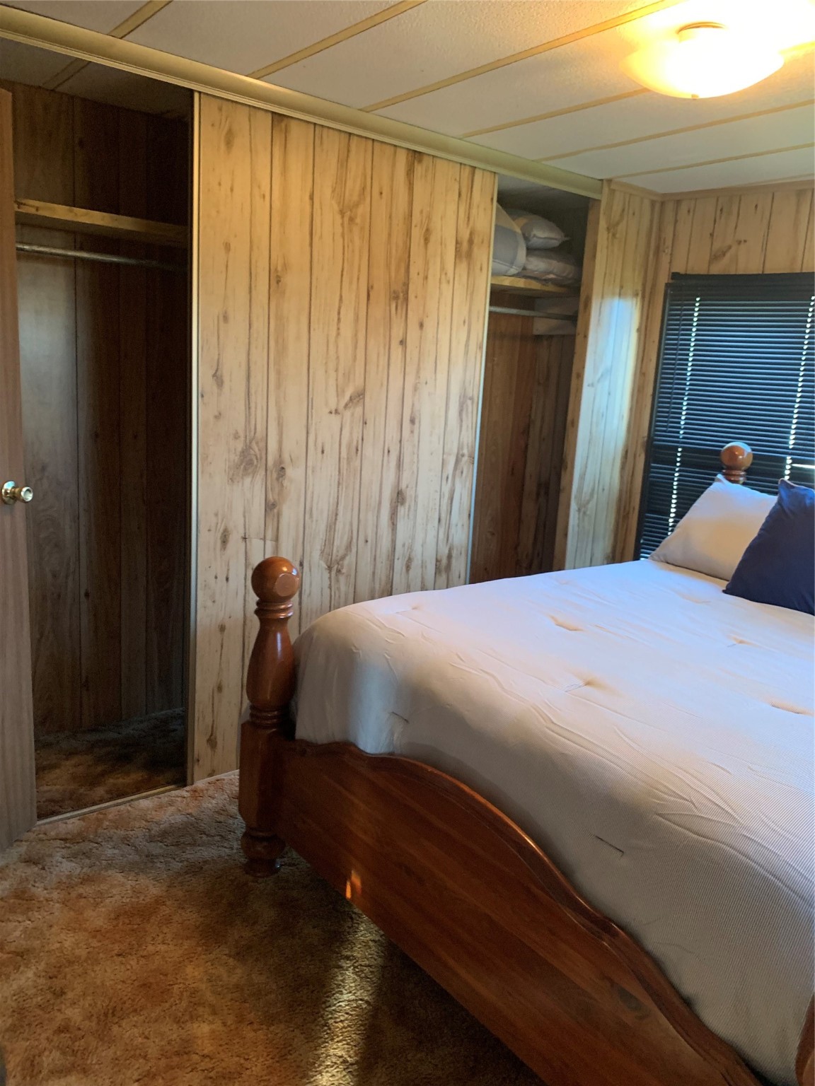 911 15th Street Port O'Connor, TX 77982 - Photo 18 of 22 a bed sitting in a bedroom next to a window