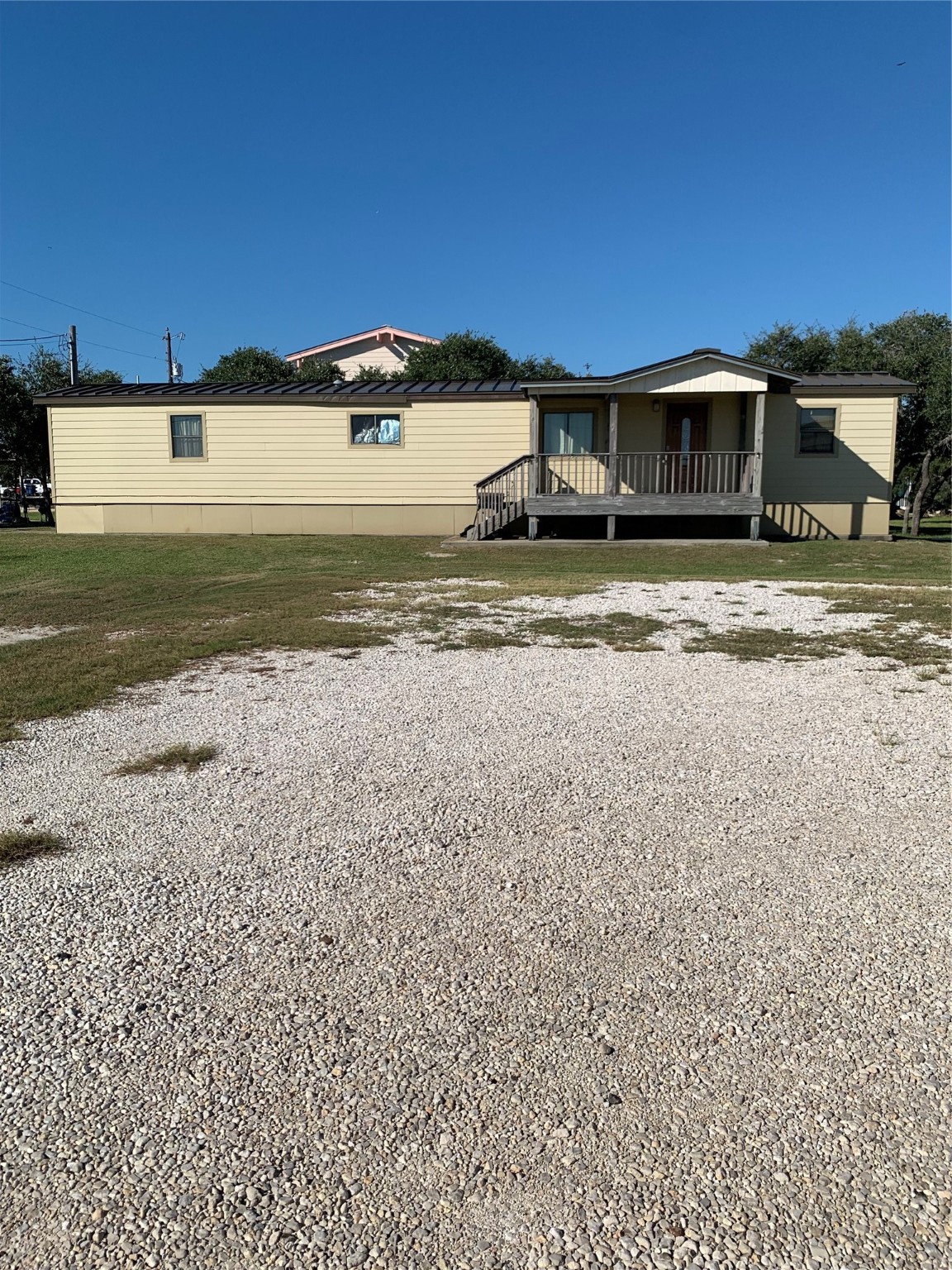 911 15th Street Port O'Connor, TX 77982 - Photo 8 of 22 a view of a house with a yard