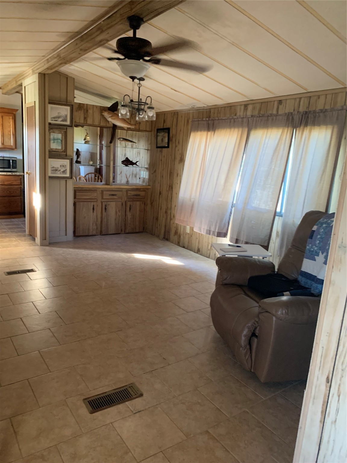 911 15th Street Port O'Connor, TX 77982 - Photo 9 of 22 a living room with furniture and a chandelier