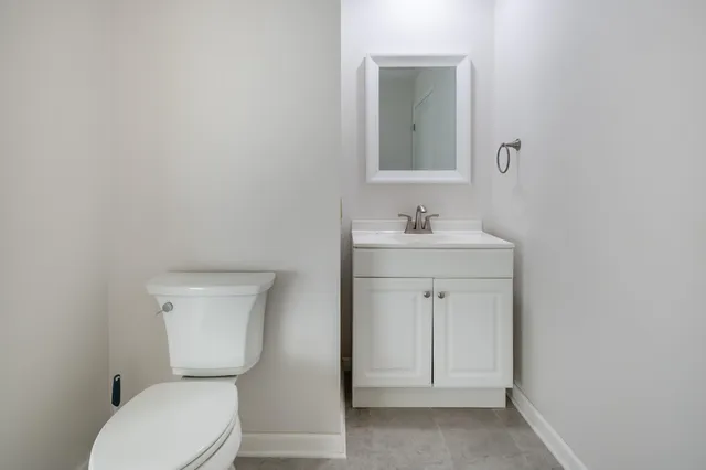 a bathroom with a toilet and bathtub