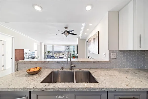 a kitchen with a sink and a microwave