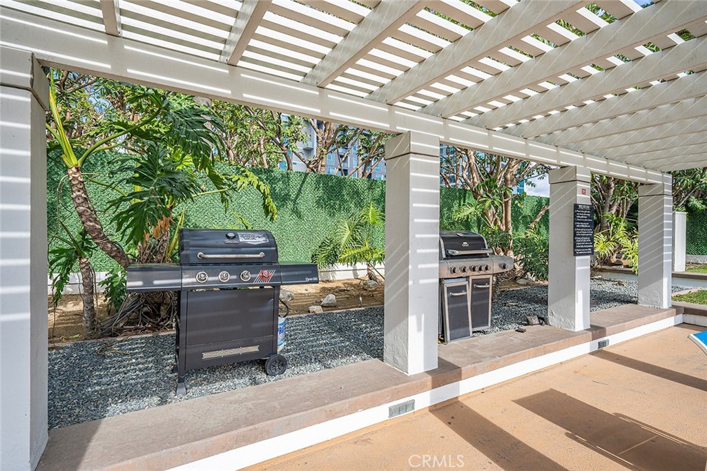 700 East Ocean Boulevard, Unit 3003 Long Beach, CA 90802 - Photo 30 of 39 a view of a porch with furniture and a backyard
