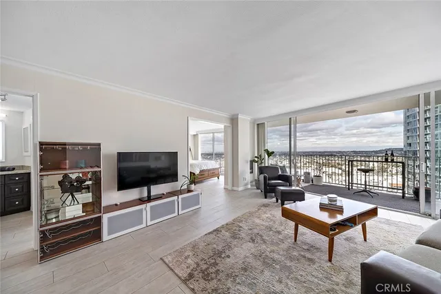 a bathroom with a granite countertop sink toilet mirror and shower