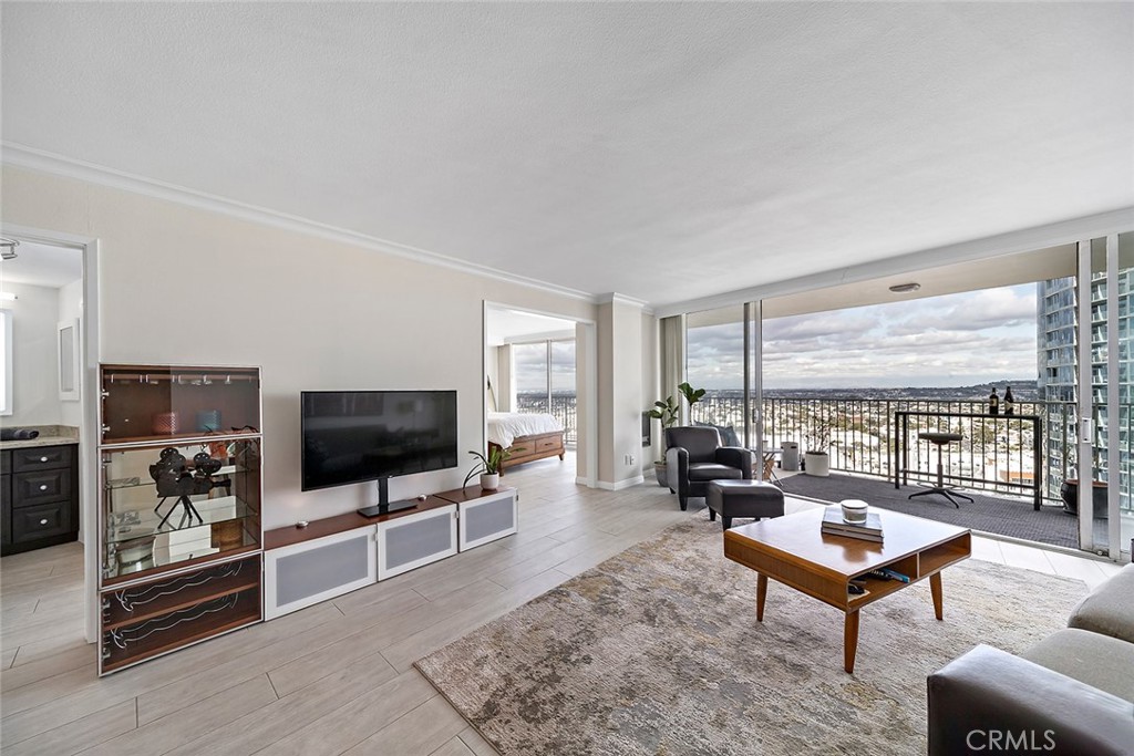 700 East Ocean Boulevard, Unit 3003 Long Beach, CA 90802 - Photo 8 of 39 a living room with furniture tv and a window