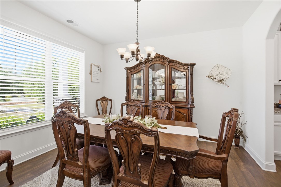525 16th Circle Walhalla, SC 29691 - Photo 37 of 50 This bright dining room features rich wood flooring and abundant natural light.