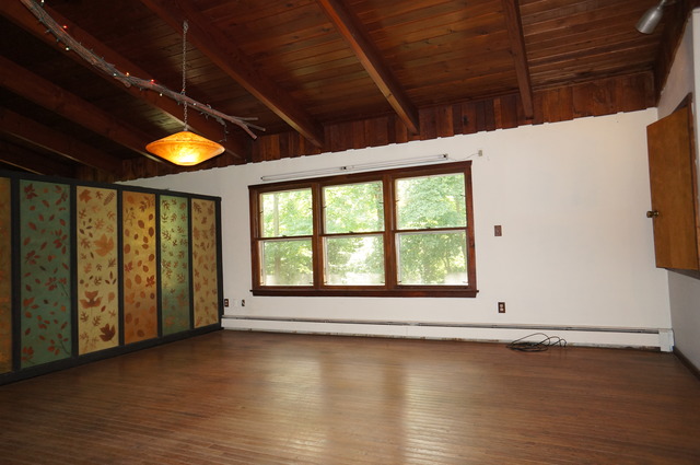 4S943 West County Line Road Big Rock, IL 60511 - Photo 9 of 24 a view of empty room with wooden floor and fan