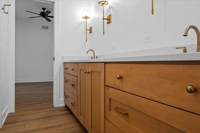 a bathroom with a double vanity sink and mirror