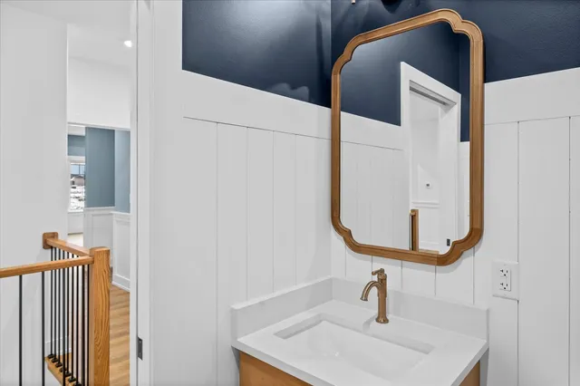 a bathroom with a sink and mirror