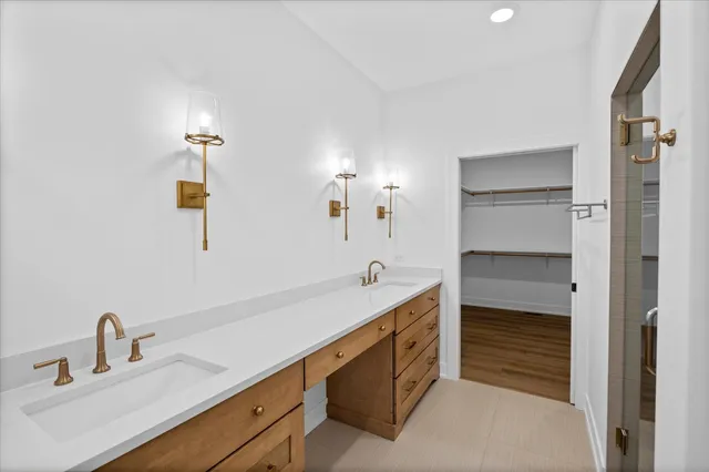 a bathroom with a double vanity sink a and a mirror