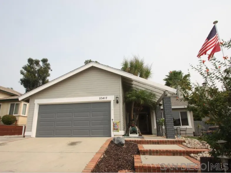 10417 Cadwell Road Santee, CA 92071 - Photo 2 of 12 a view of a house with a yard and potted plants