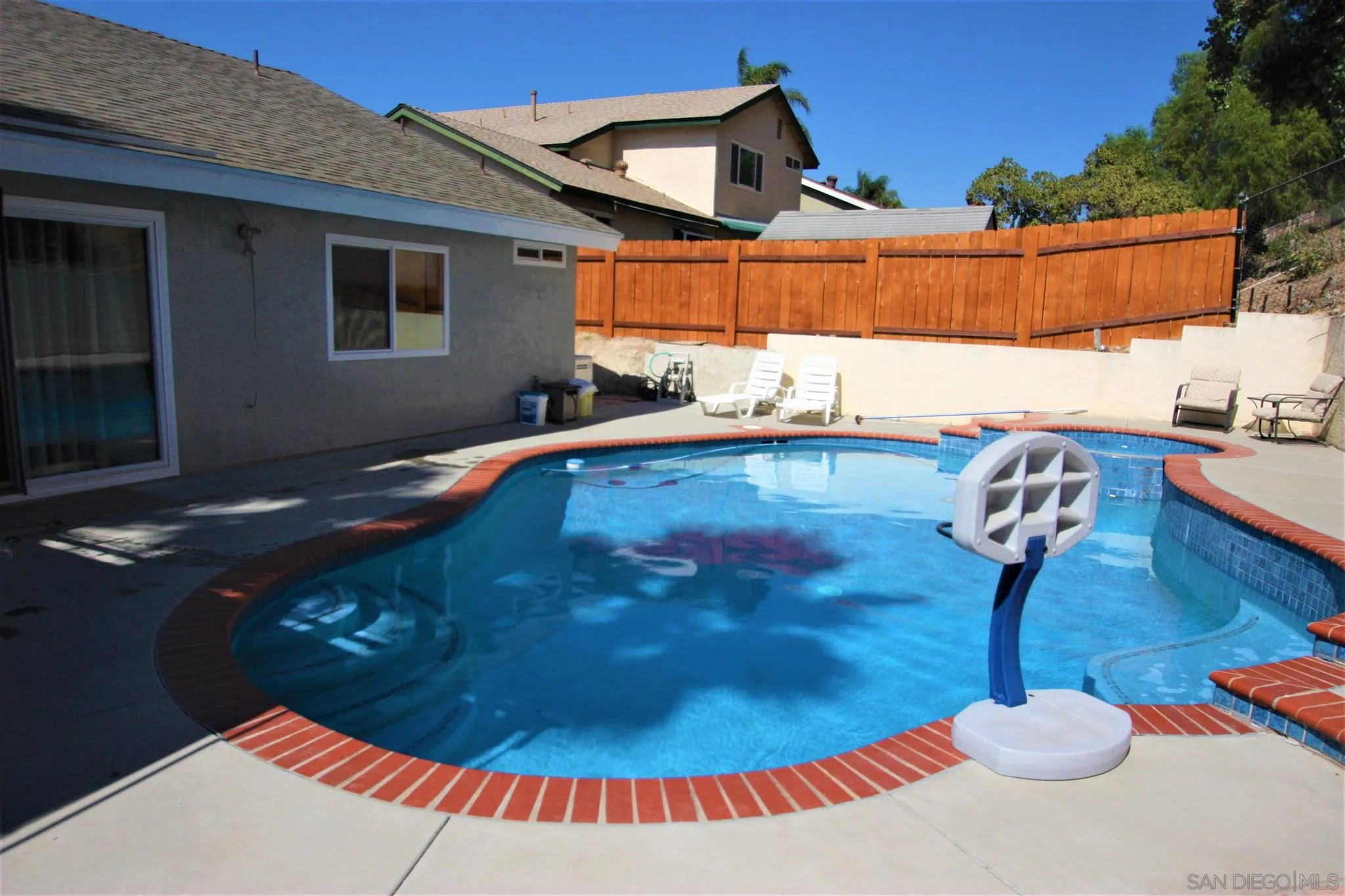 10417 Cadwell Road Santee, CA 92071 - Photo 9 of 12 a backyard of a house with table and chairs