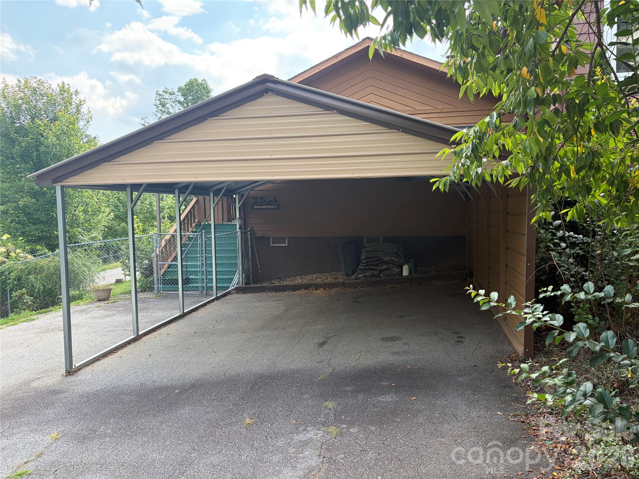 256 A Bruce Road Mars Hill, NC 28754 - Photo 2 of 39 a view of a house with a yard plants and large tree
