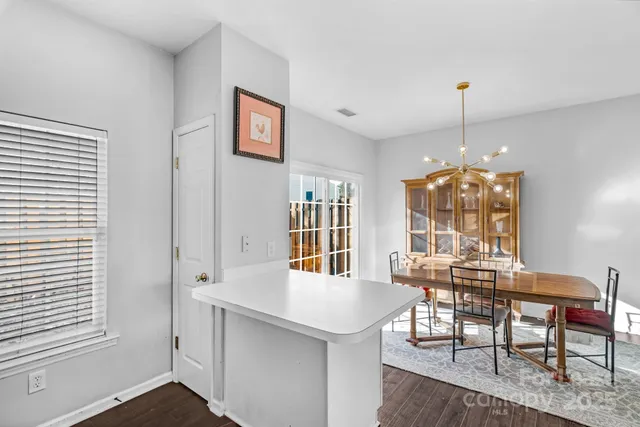 a view of a livingroom with furniture window and wooden floor