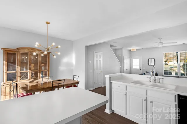 a large bathroom with a sink vanity granite and a mirror