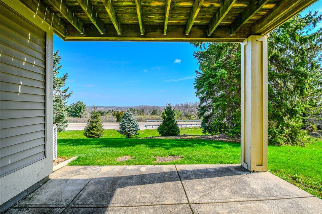3915 East Summit Ridge Drive Beavercreek, OH 45430 - Photo 40 of 47 Enjoy the expansive view from this peaceful outdoor patio, perfect for relaxation and fresh air.