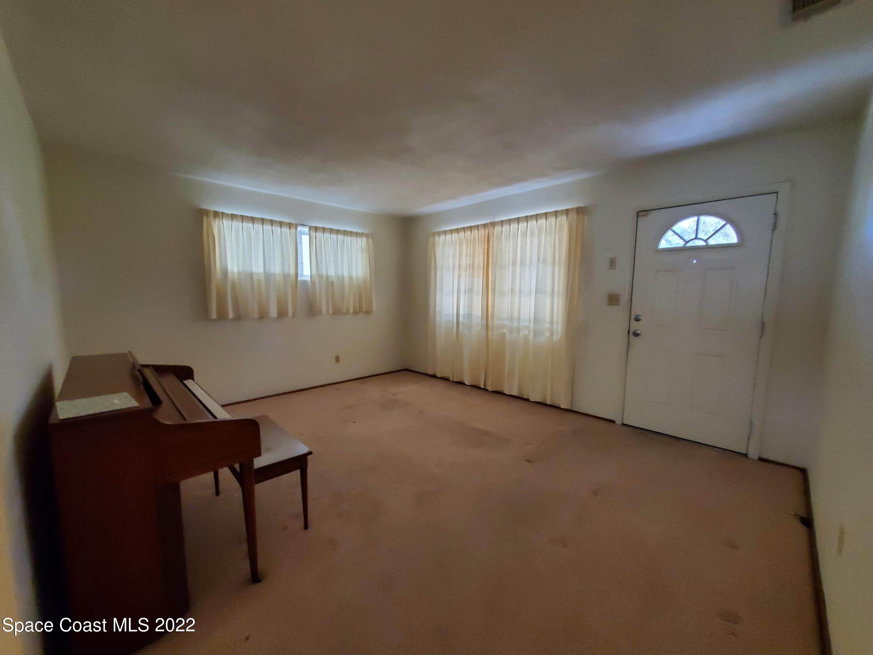 1507 Emory Lane Cocoa, FL 32922 - Photo 14 of 57 a view of empty room with windows