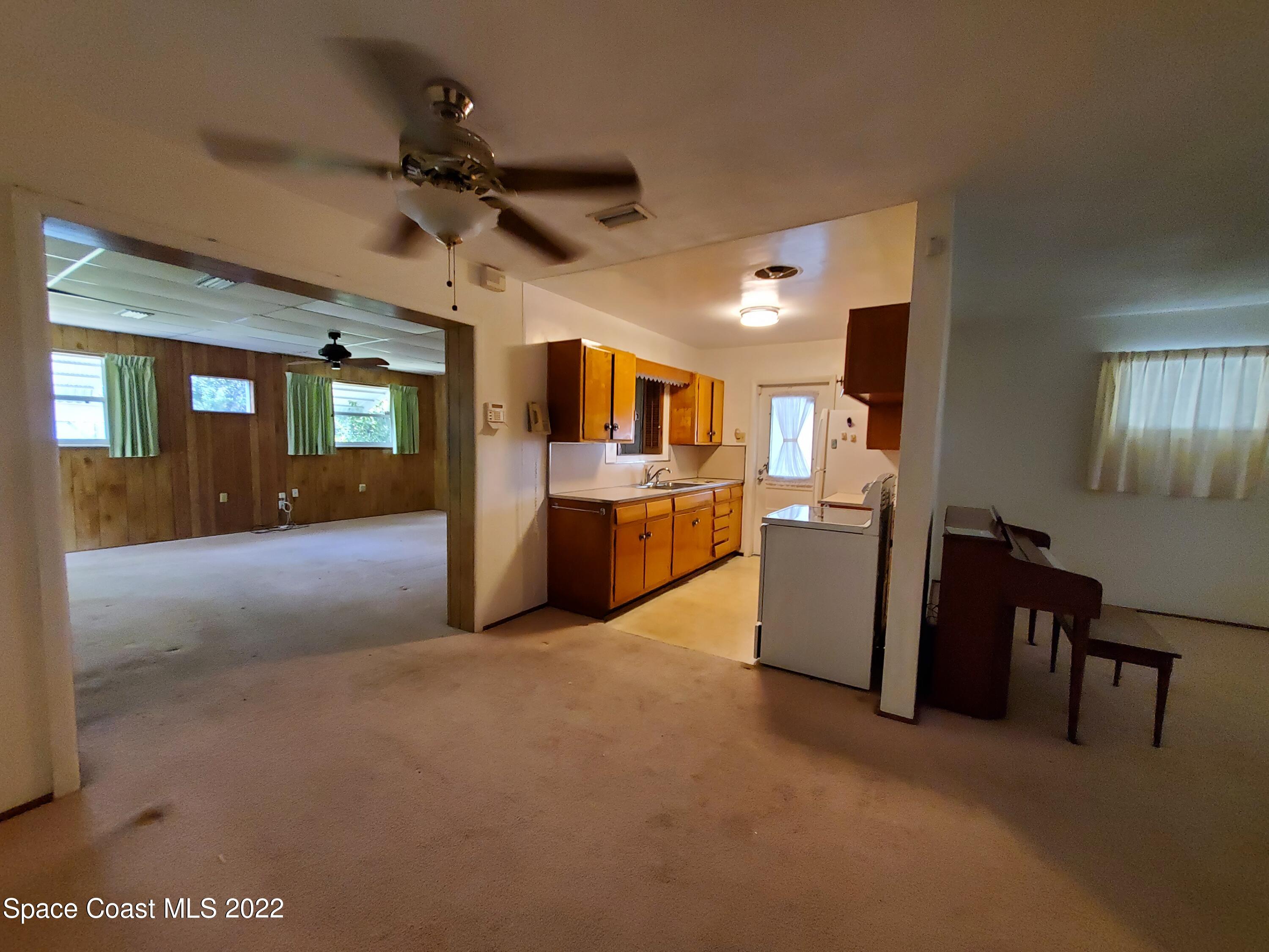 1507 Emory Lane Cocoa, FL 32922 - Photo 16 of 57 a view of a kitchen with furniture and a kitchen
