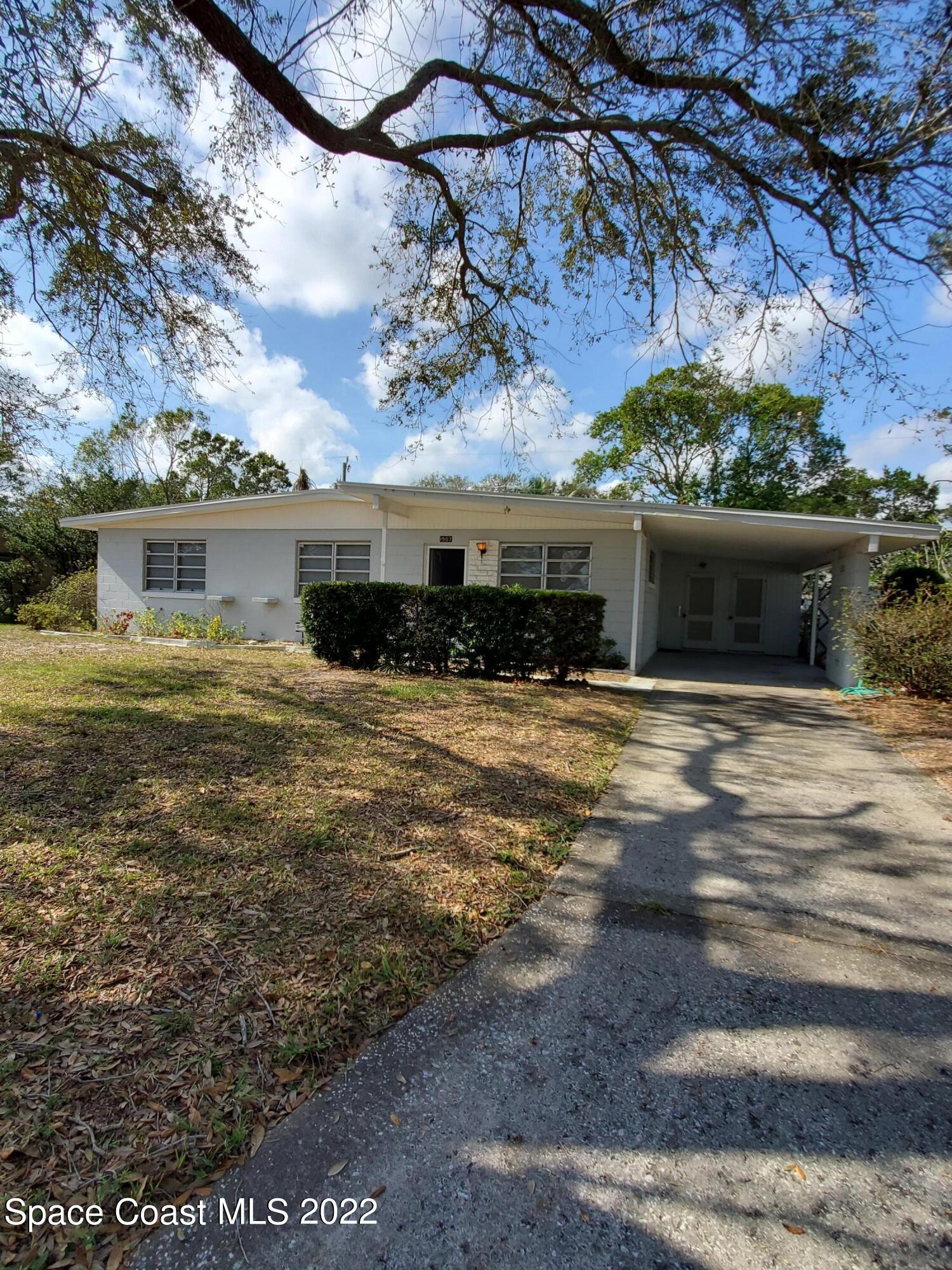 1507 Emory Lane Cocoa, FL 32922 - Photo 2 of 57 a view of house with outdoor space