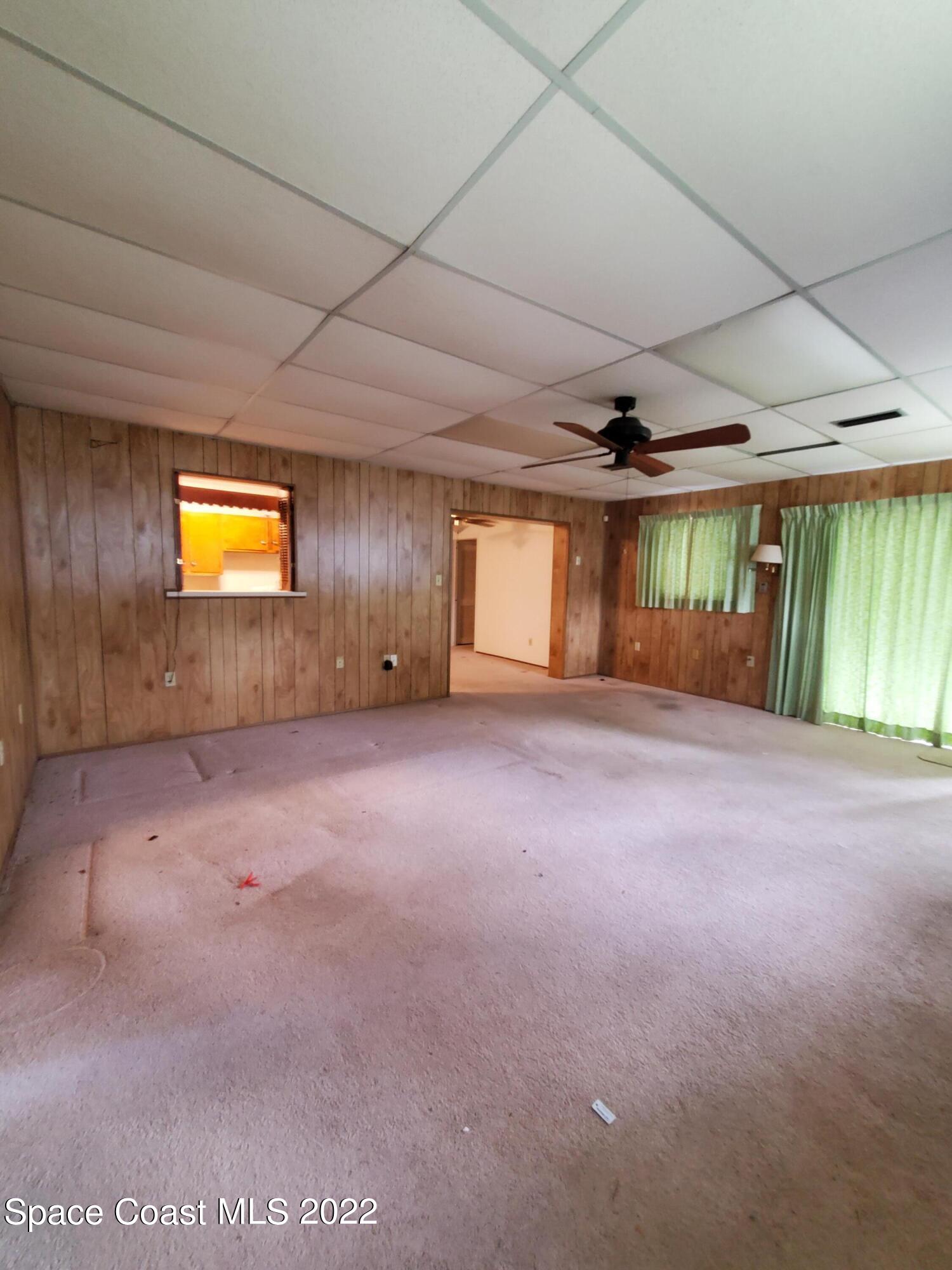 1507 Emory Lane Cocoa, FL 32922 - Photo 21 of 57 a view of an empty room with a window and fireplace