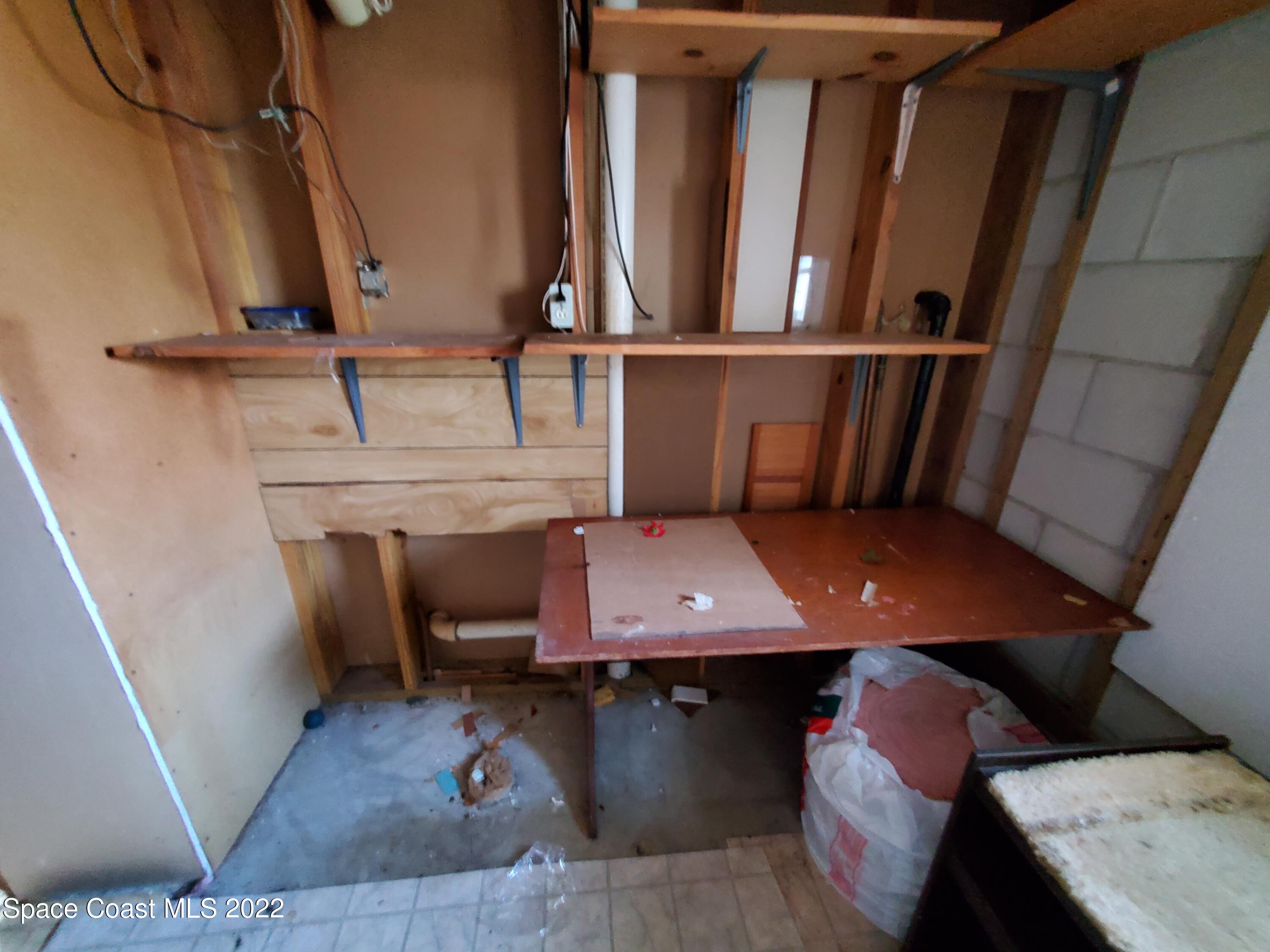 1507 Emory Lane Cocoa, FL 32922 - Photo 27 of 57 a view of a hallway with seating space