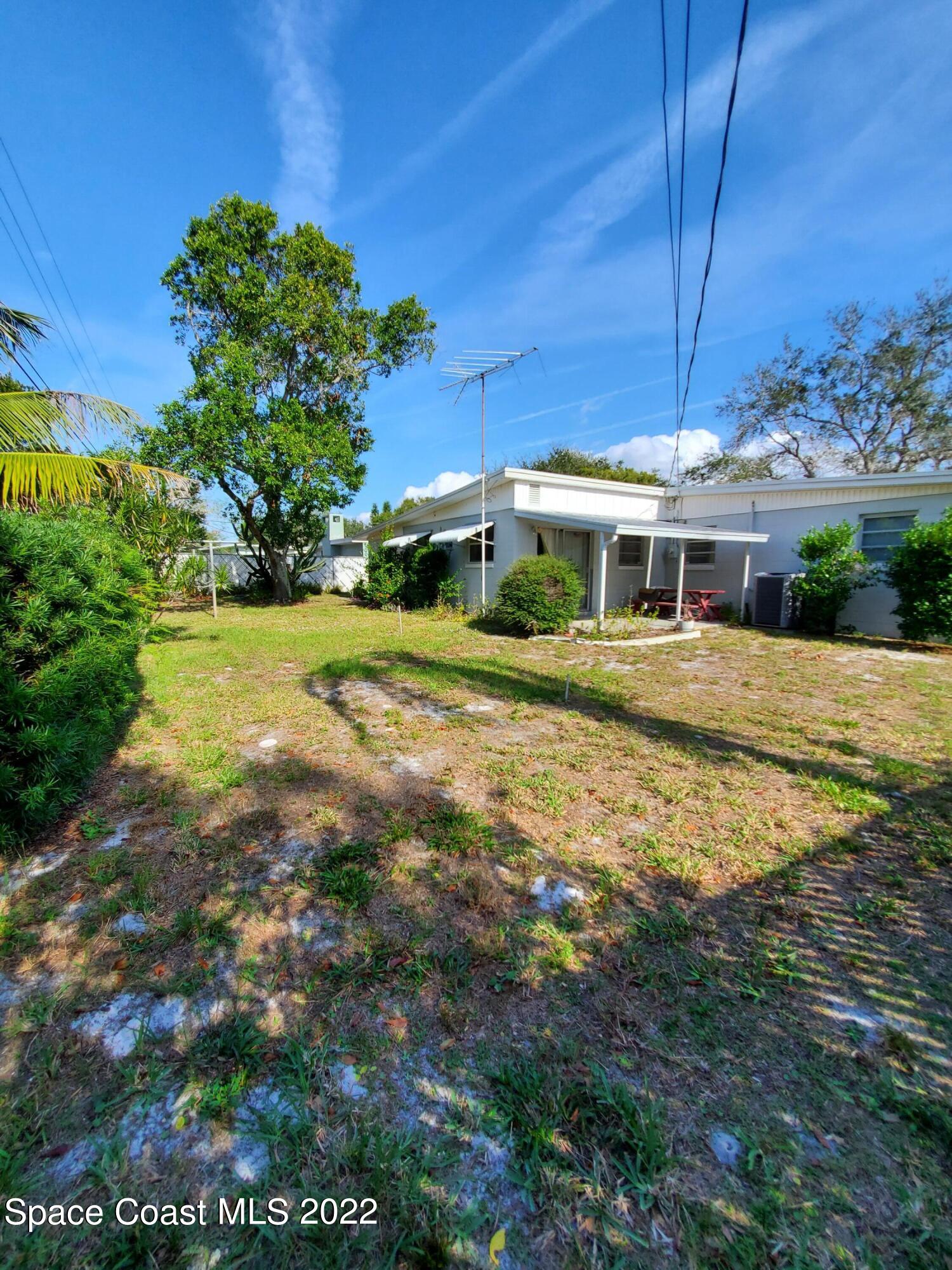 1507 Emory Lane Cocoa, FL 32922 - Photo 10 of 57 a view of a house with a yard