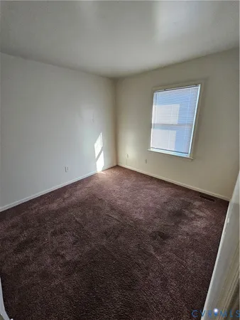 en empty room with windows