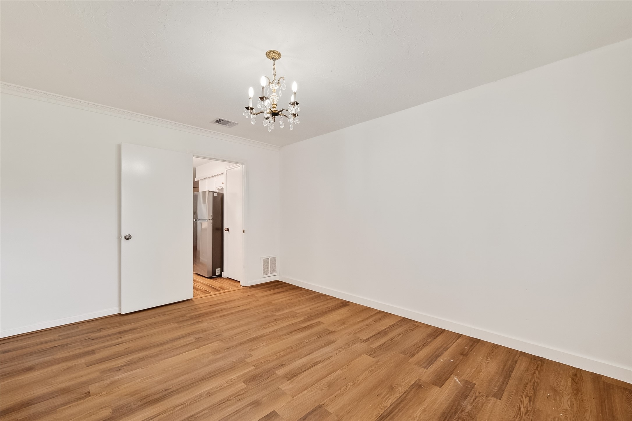 9218 Rowan Lane Houston, TX 77036 - Photo 18 of 32 a view of a room with wooden floor and ceiling fan