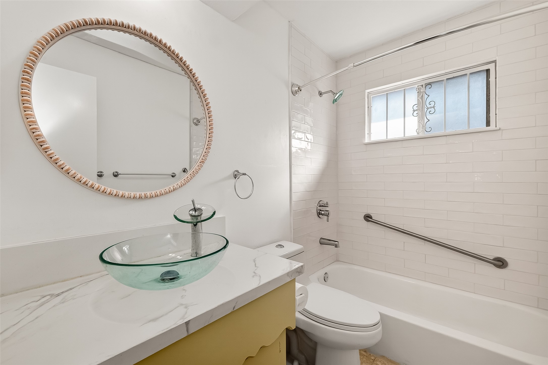 9218 Rowan Lane Houston, TX 77036 - Photo 23 of 32 a bathroom with a sink a toilet and a mirror