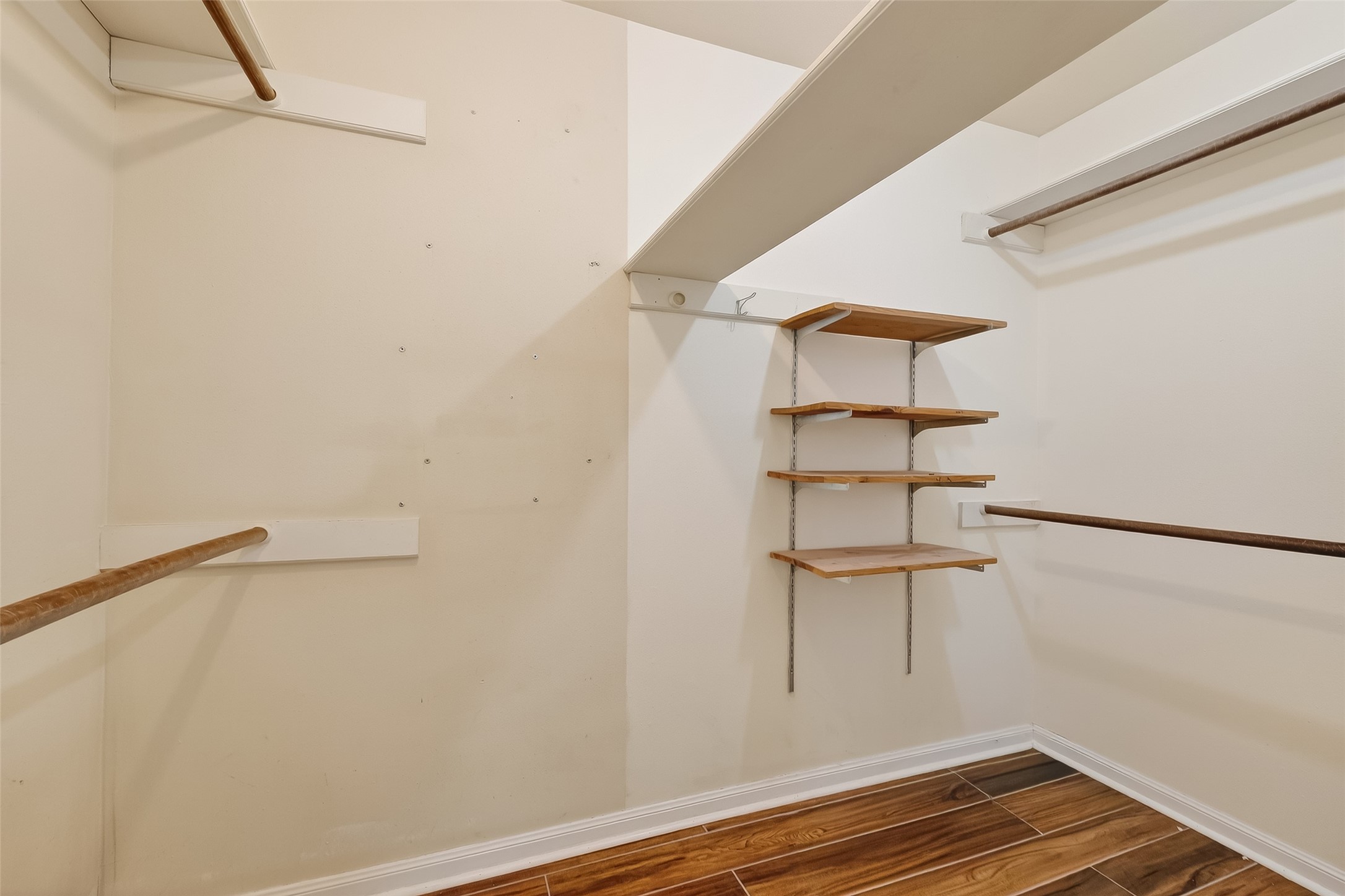 9218 Rowan Lane Houston, TX 77036 - Photo 29 of 32 a view of empty room with wooden floor