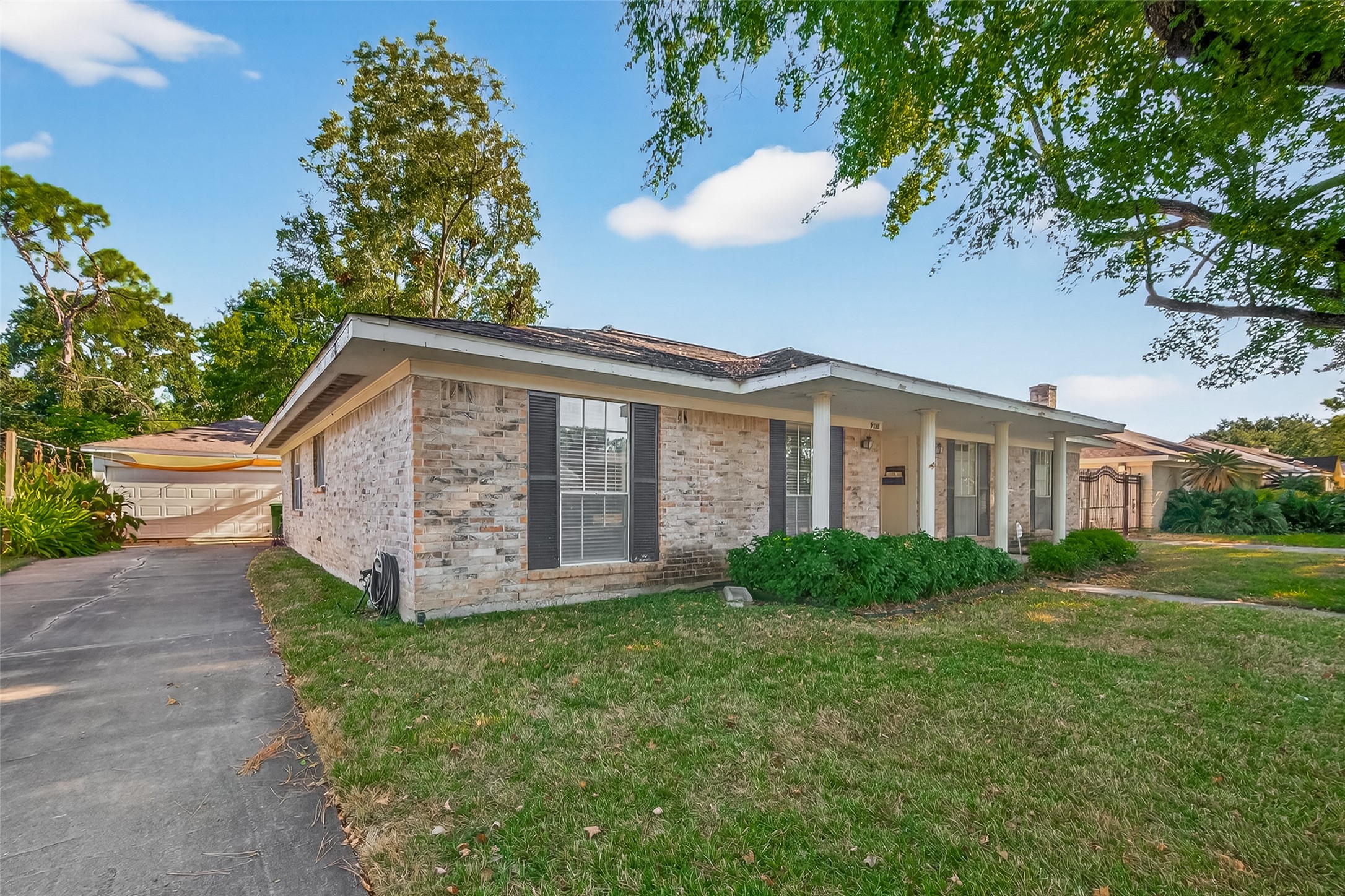 9218 Rowan Lane Houston, TX 77036 - Photo 32 of 32 a view of a house with yard and sitting area