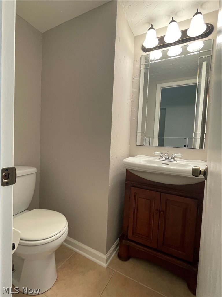 6577 Engle Road, Unit 41D Brook Park, OH 44142 - Photo 17 of 32 Bathroom with tile flooring, large vanity, and toilet