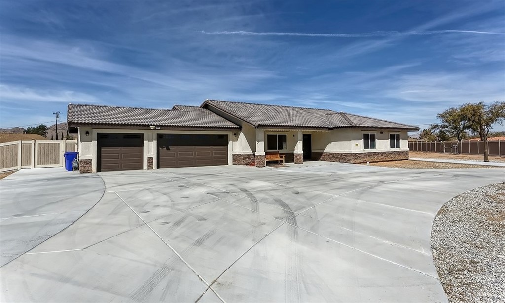 15326 Comanche Road Apple Valley, CA 92307 - Photo 1 of 1 front view of a house with a patio