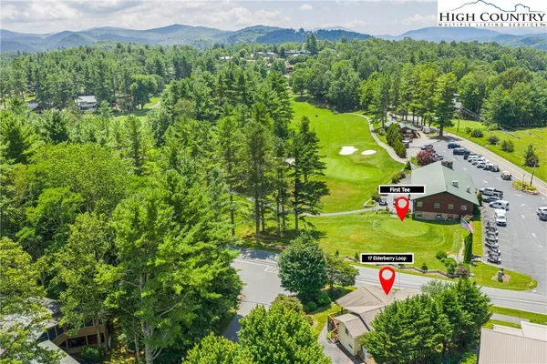 a view of a chairs and table in the balcony
