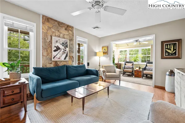 a living room with a couch and a window