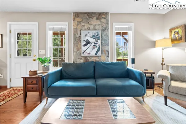 a living room with furniture and a large window